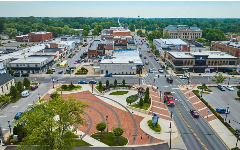 LiDAR Mapping in Downtown Auburn AL Aerial City View - ALTA Survey Alabama Aerial view of a well-planned downtown district with organized streets, green spaces, and buildings—ideal for illustrating LiDAR mapping applications in Auburn, AL.