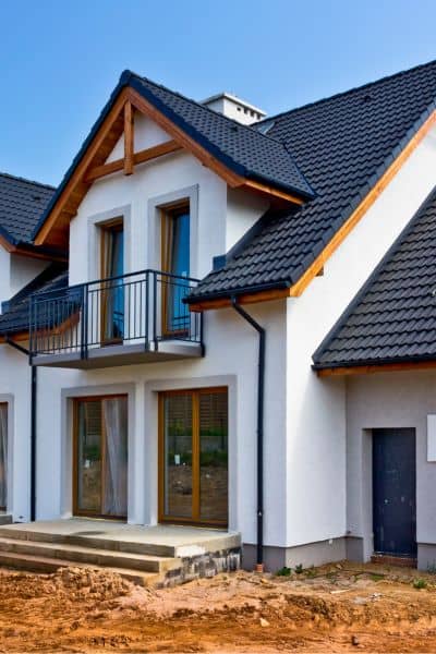 Newly constructed homes in Chelsea showcasing rapid housing development supported by construction surveys.
