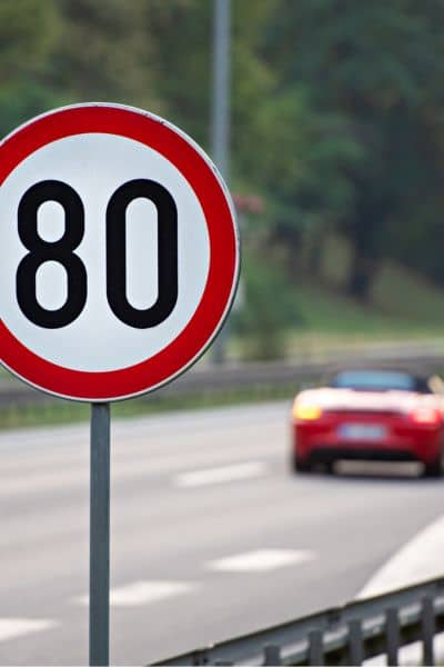 Speed limit 80 sign on a highway in Huntsville, illustrating traffic engineering efforts to improve road safety and flow.

