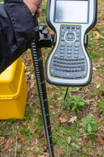 Close-up of GNSS data collector used by construction surveyors for OPUS fast-static processing in the field
