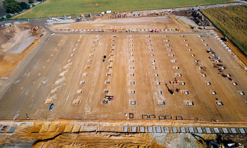 Aerial view of a large earthwork site where grading plans guide soil shaping and site preparation for future development