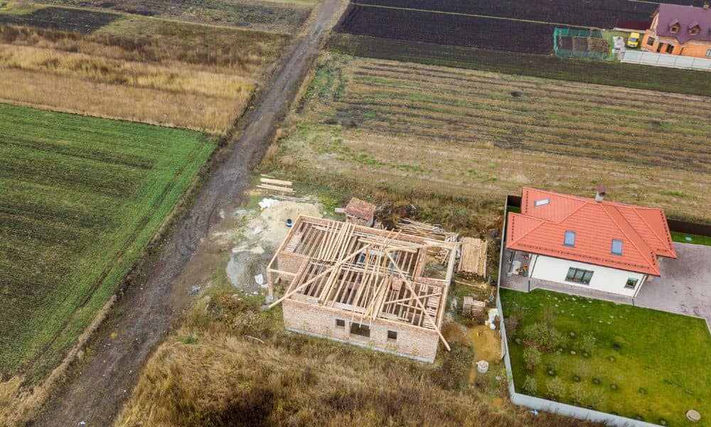 Aerial property view dispute scene - ALTA Survey Alabama Drone survey view showing two neighboring properties with unclear boundaries