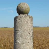 Concrete survey boundary monument - ALTA Survey Alabama Concrete boundary monument used during property line surveys to define legal property corners