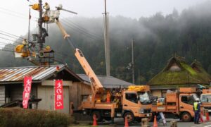 Utility crews working near a home, showing why a mortgage survey often misses easements that allow access to a property