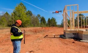 Construction site drone flight - ALTA Survey Alabama Drone surveying in progress over an active construction site to help reduce project delays