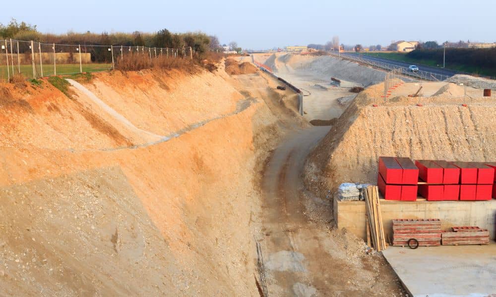 Road expansion land grading construction - ALTA Survey Alabama Large road expansion project reshaping land as nearby property owners search for surveyors near me