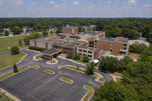 Aerial view of a former hospital campus, documenting buildings, parking areas, and access roads for a due diligence survey
